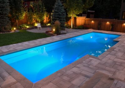 Small swimming pool with stone pavers